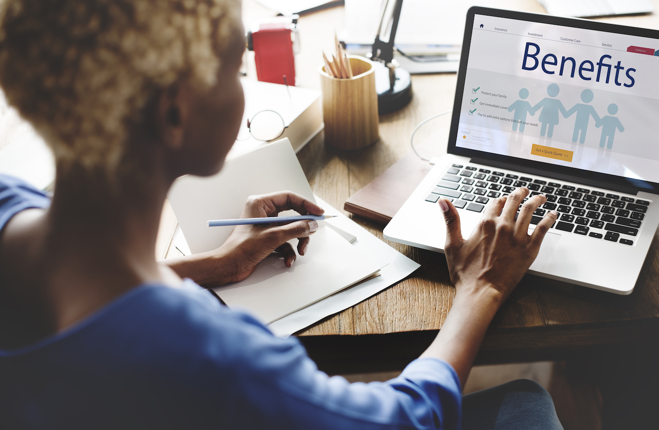 Woman looking at employer benefits website. 